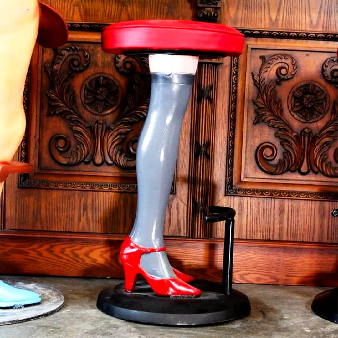 pair of girls legs bar stools with high heels and stockings