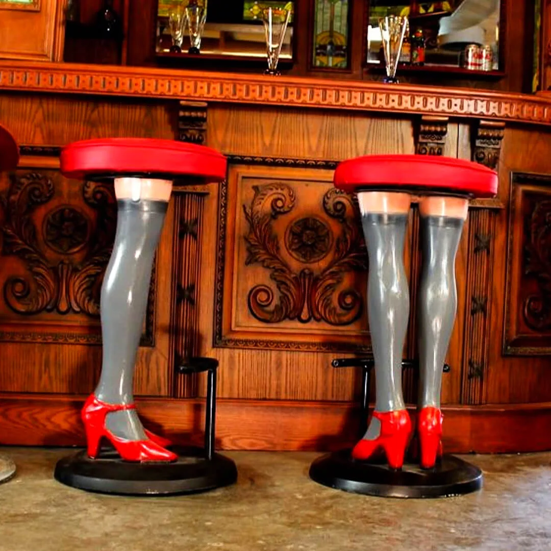 pair of girls legs bar stools with high heels and stockings