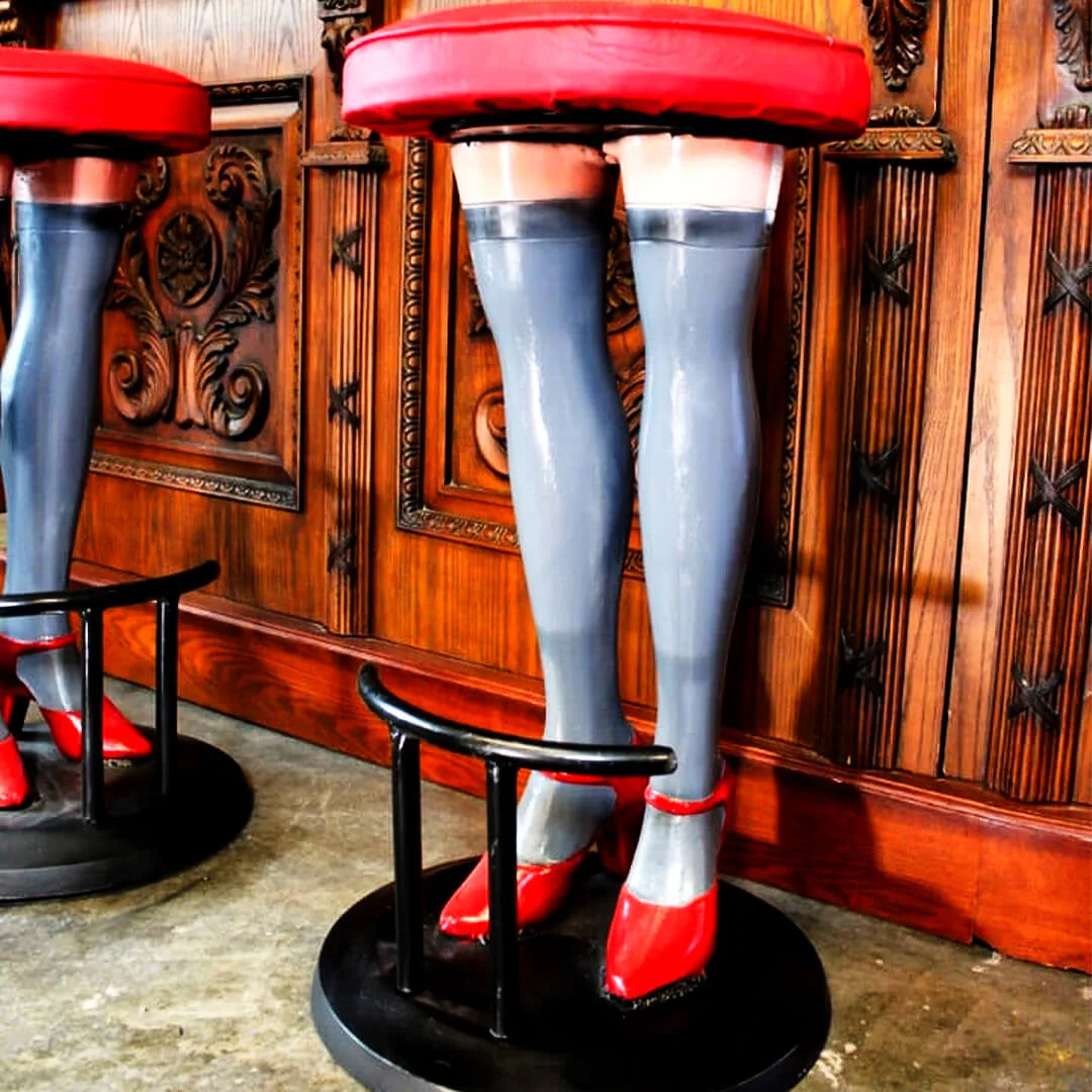 pair of girls legs bar stools with high heels and stockings