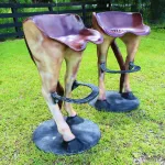 pair of horse tail bar stools with foot rests