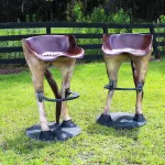pair of horse tail bar stools with foot rests