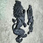 pair of wall mounted royal lion crest sculptures