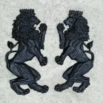 pair of wall mounted royal lion crest sculptures