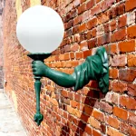 statue of liberty torch bearing arm wall sconce