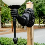 statue of liberty torch bearing arm wall sconce