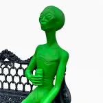 sitting alien statue drinking aluminum glow in dark