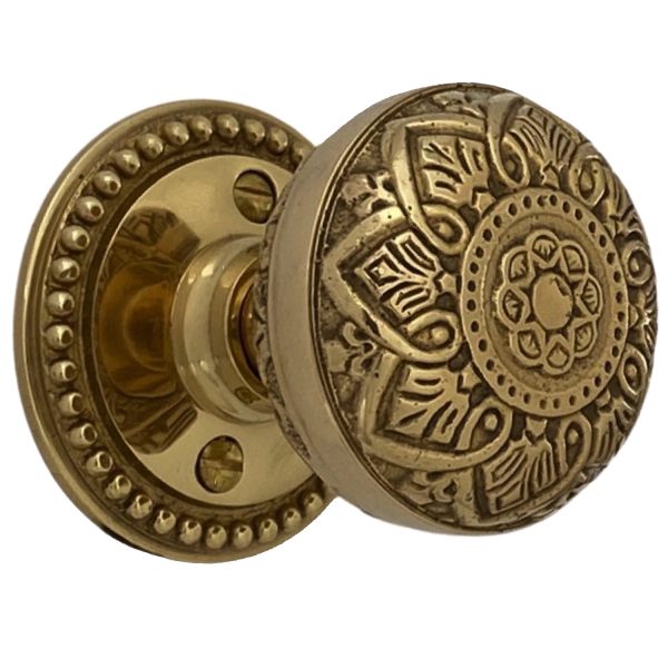 beaded round rosette privacy set in polished brass with spade door knobs