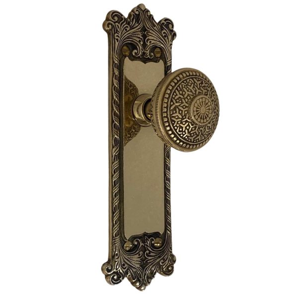 the classic passage set in polished brass with rice door knobs
