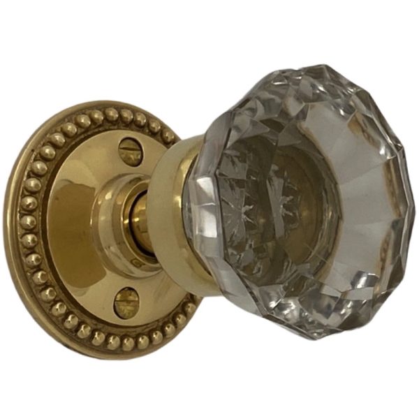 beaded round rosette passage set in polished brass with glass door knobs