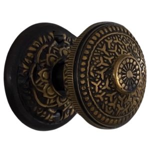 spade round rosette dummy set in highlighted bronze with rice door knobs