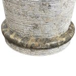 cone shaped pedestal sink with dark grey granite marble