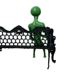 alien statue sitting on bench drinking can glow in dark