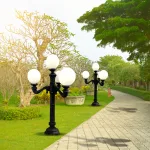 pair of 4 arm pole light street fixtures for outdoors 10 or 12 inch ball shade
