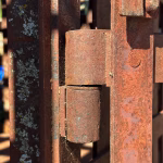 real antique rusted iron jail cell prison with fold up bed western holding cell