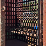 real antique rusted iron jail cell prison with fold up bed western holding cell