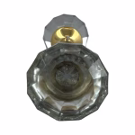 pair of clear glass door knobs with brass ferrules