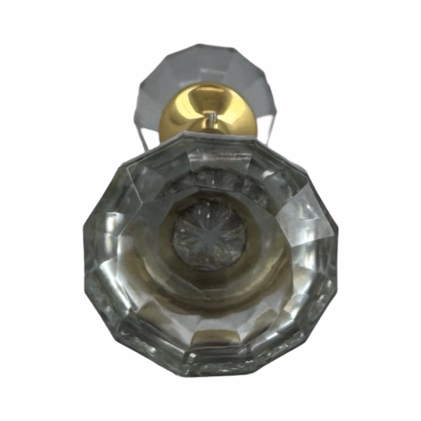 pair of clear glass door knobs with brass ferrules