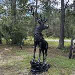 elk statue on rocks 10 foot bronze painted aluminum – left facing