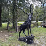 elk statue on rocks 10 foot bronze painted aluminum – left facing