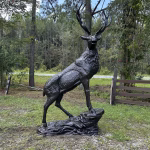 elk statue on rocks 10 foot bronze painted aluminum right facing