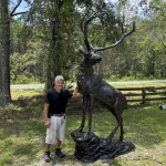 elk statue on rocks 10 foot bronze painted aluminum – left facing