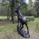 elk statue on rocks 10 foot bronze painted aluminum – left facing