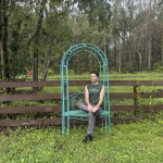 steel garden arbor trellis with seat in aged blue