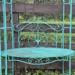 steel garden arbor trellis with seat in aged blue
