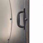 pair of rivet brutalist style sliding door and track closet hanging