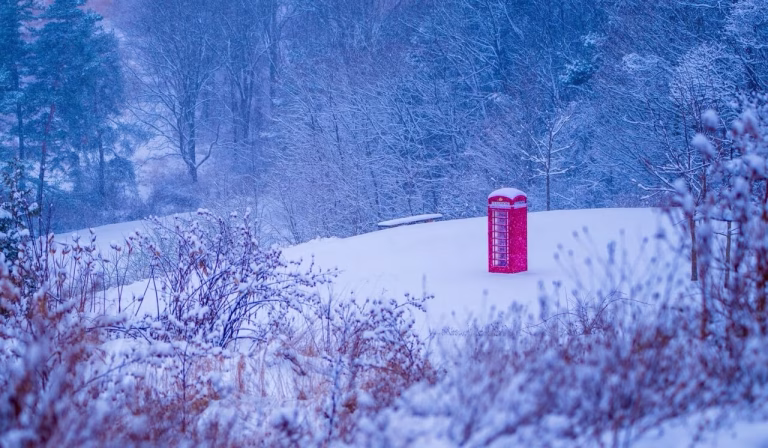 Customer Showcase Customer photo of a pink British telephone booth from The Kings Bay in a snowy winter landscape