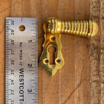 ribbed swivel keyhole escutcheon in cast solid brass
