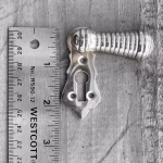 bronze ribbed swivel keyhole escutcheon