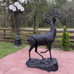 Stag Deer Statue on Rock Base Cast Aluminum Painted Buck Sculpture 67 Inches, angled view
